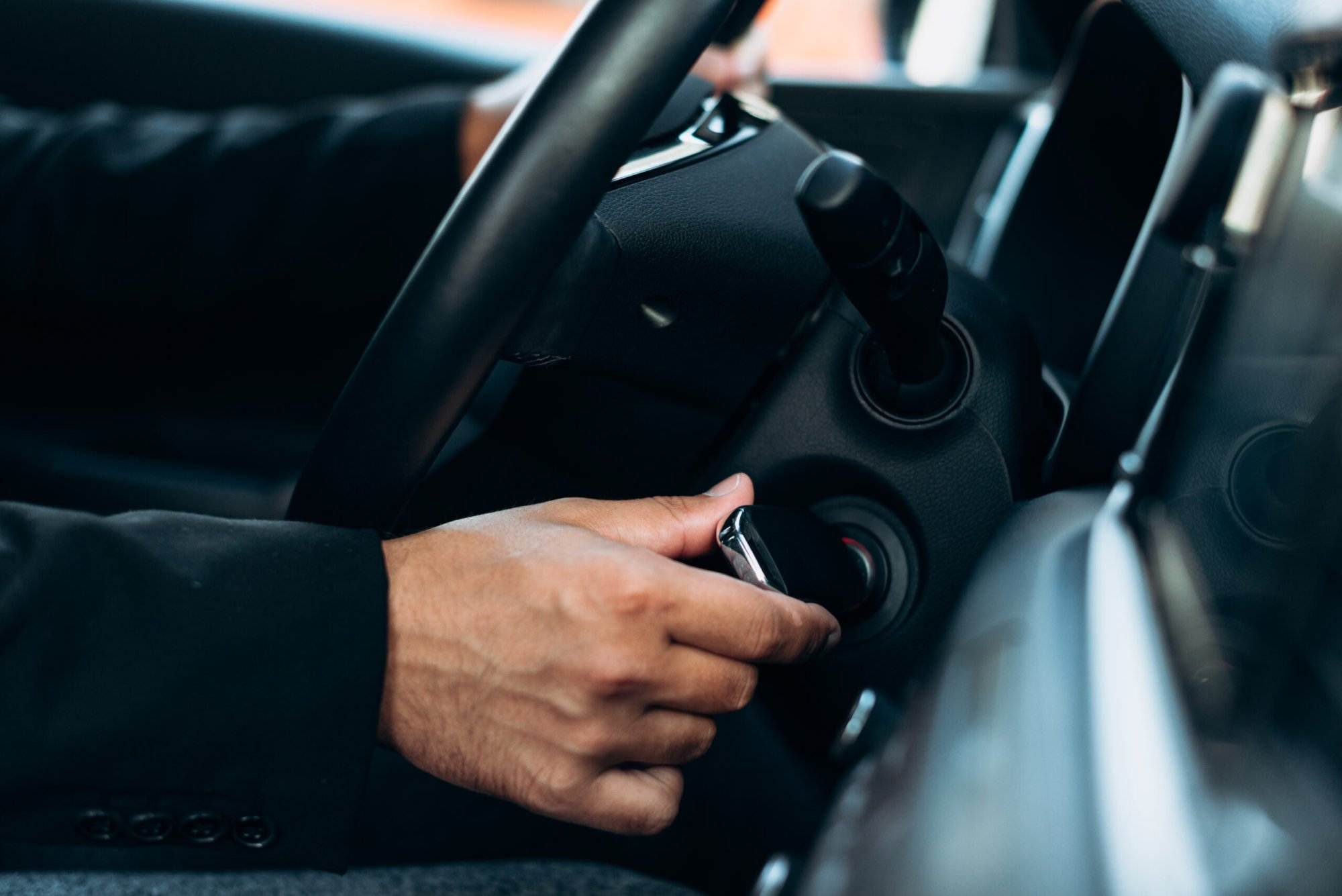 Picture of the inside of a car featuring the ignition.